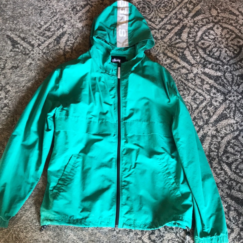 Green Stussy windbreaker